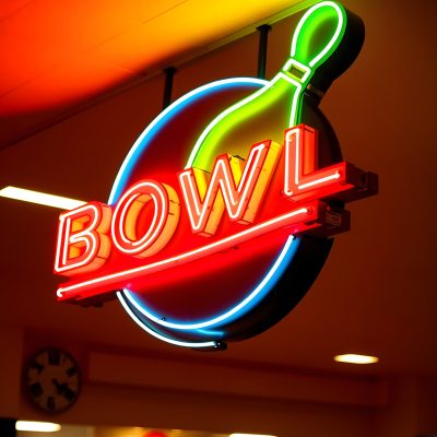 vintage neon bowl sign on bowling alley, Side lit, with white tones